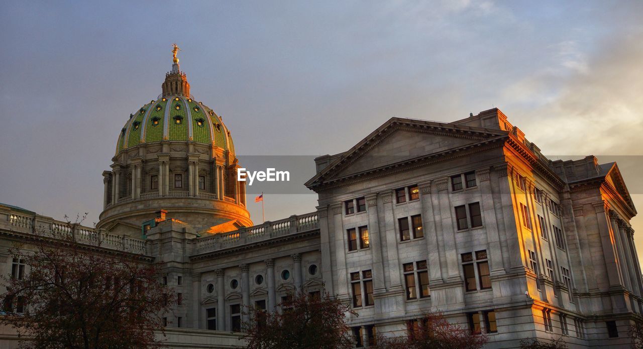 Exterior of pennsylvania state capitol against sky during sunset