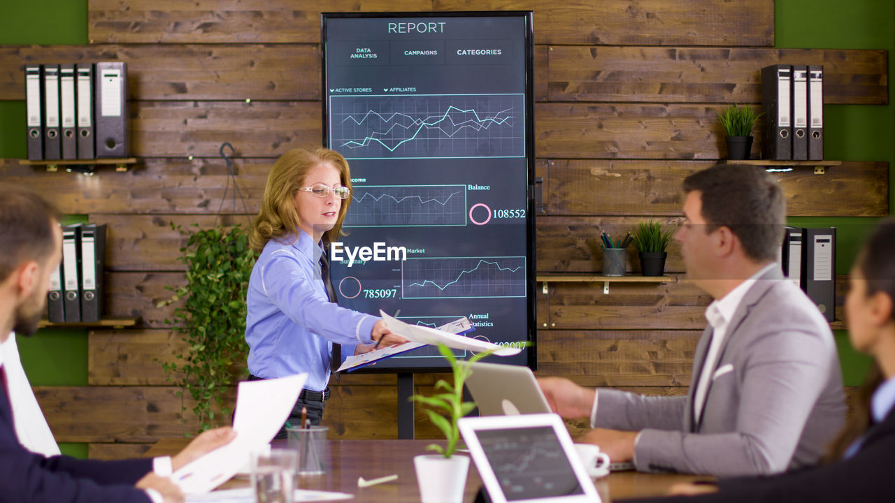 business colleagues working at desk in office