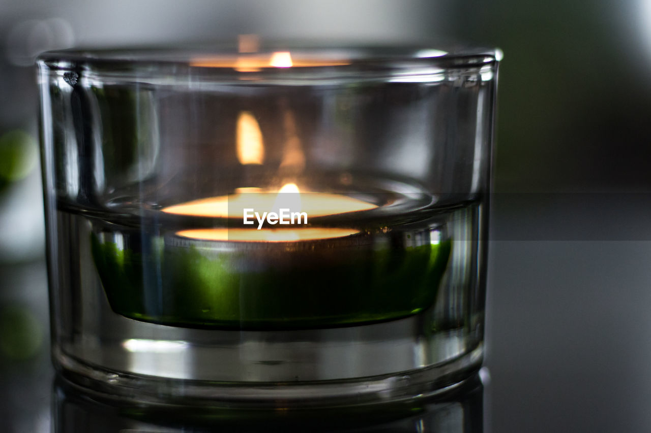 Macro photo of a tea light in a glass case