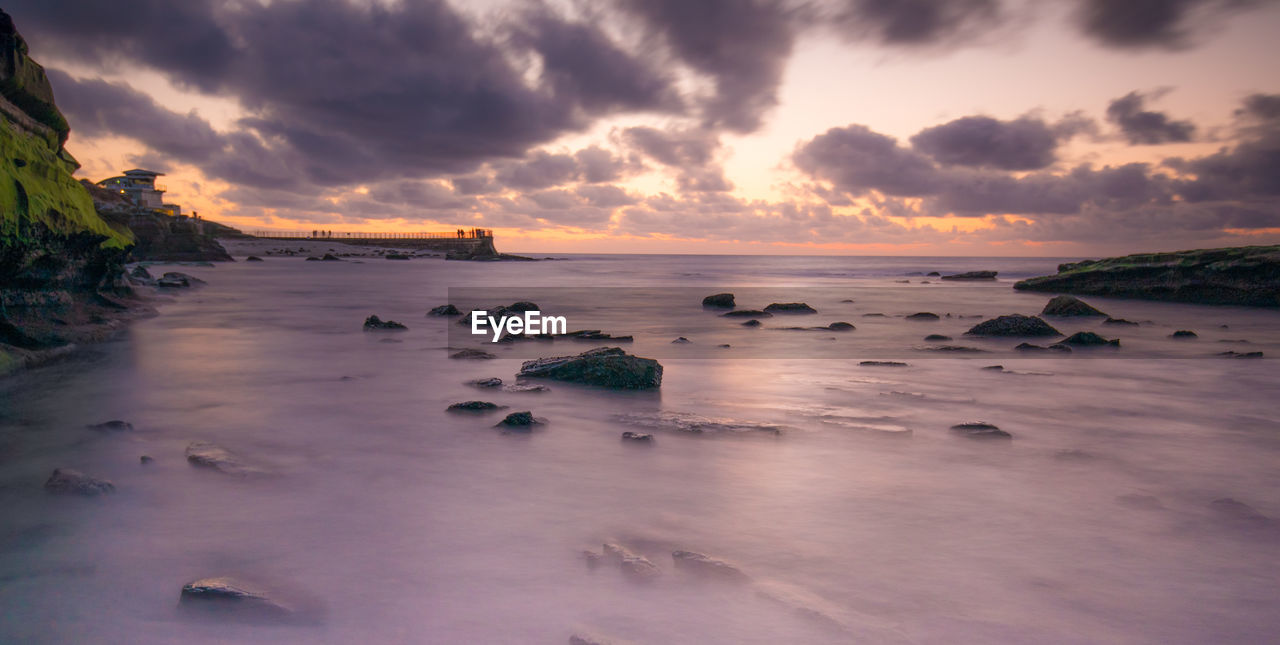 Scenic view of sea against sky at sunset