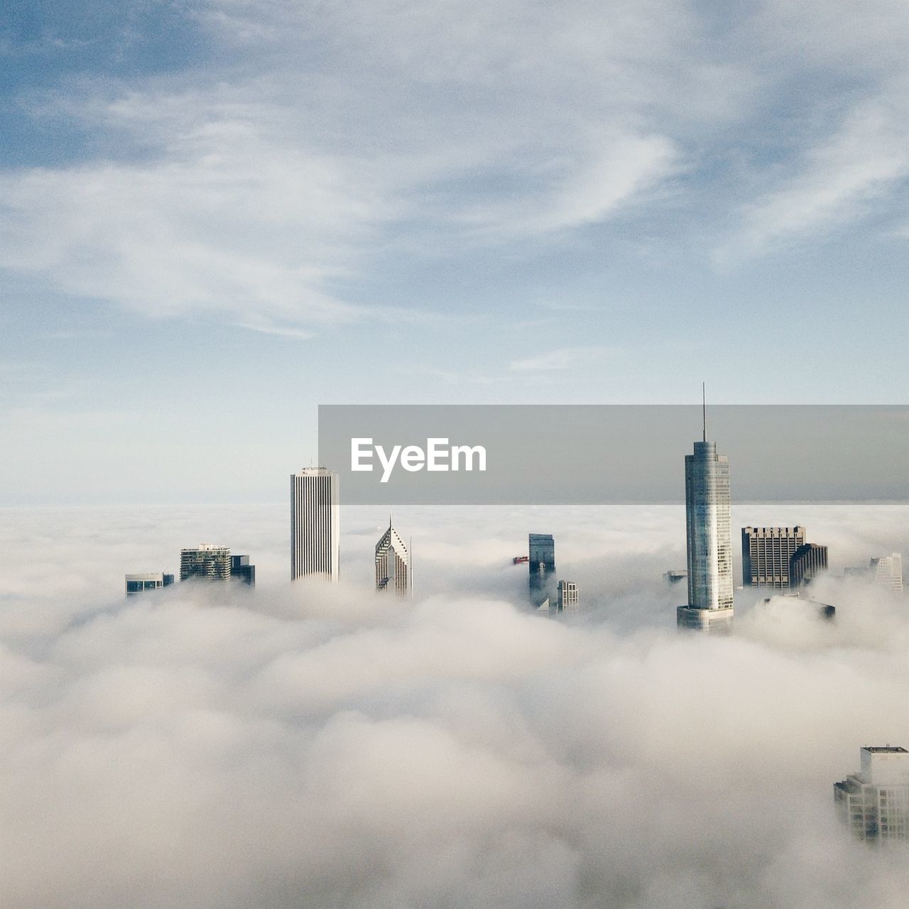 View of cityscape covered with clouds