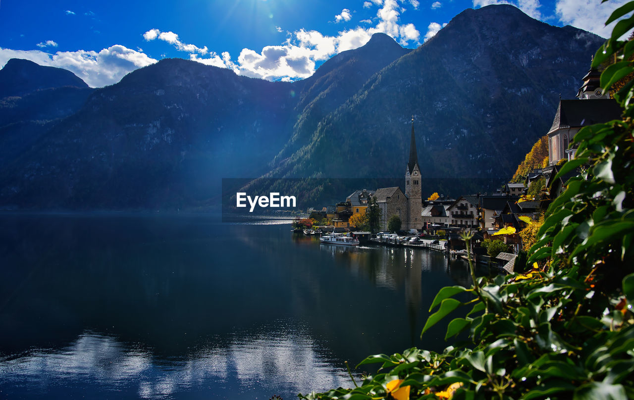 scenic view of lake by snowcapped mountains against sky
