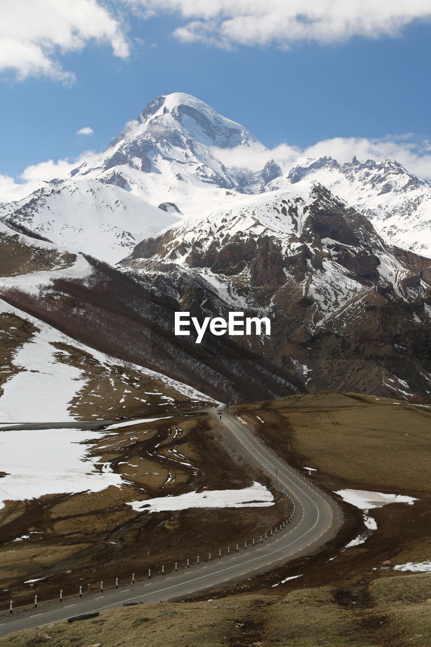 SNOWCAPPED MOUNTAINS AGAINST SKY