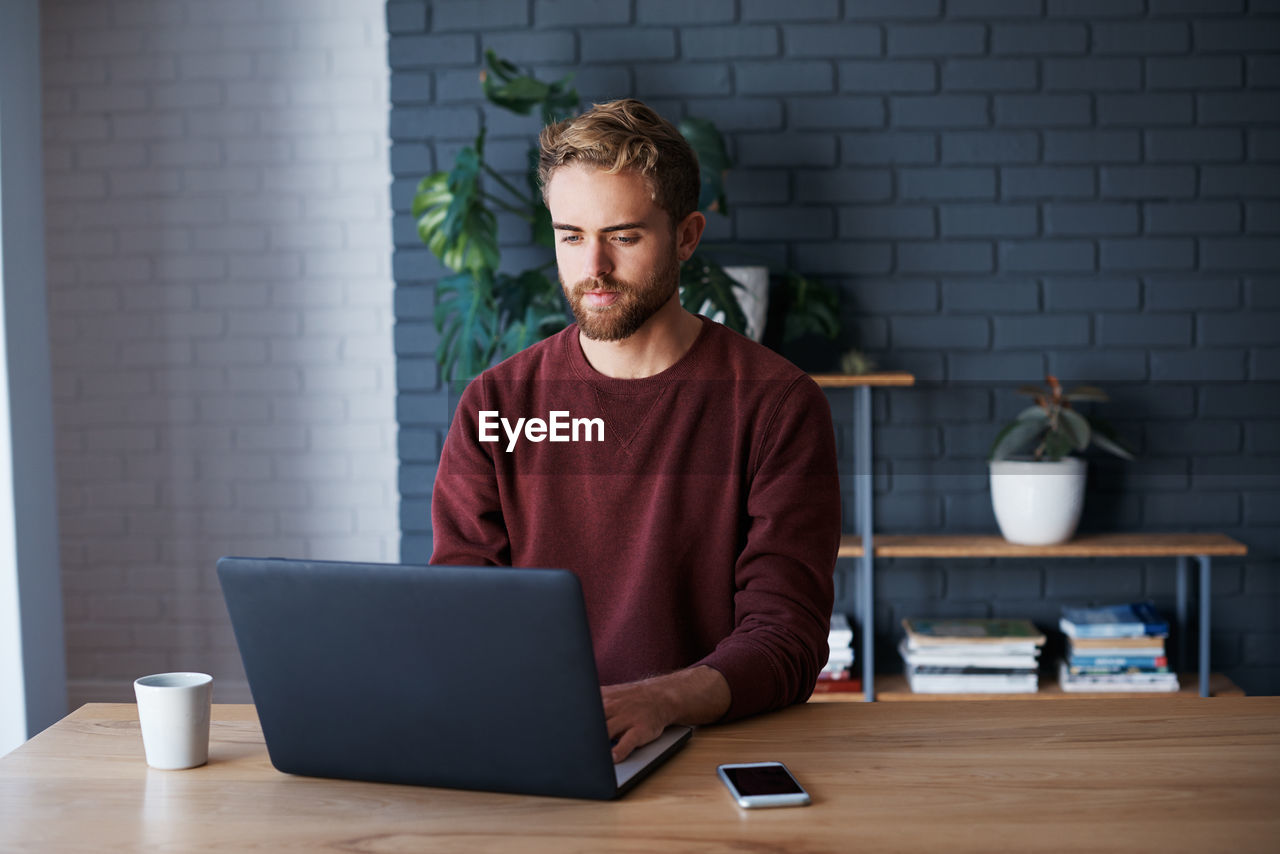 Businessman using laptop at office