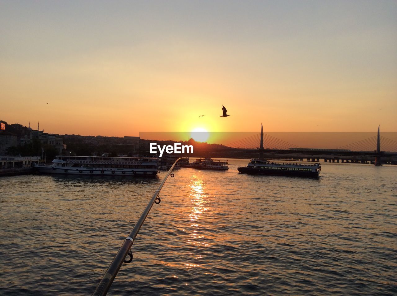 VIEW OF SUSPENSION BRIDGE OVER SEA