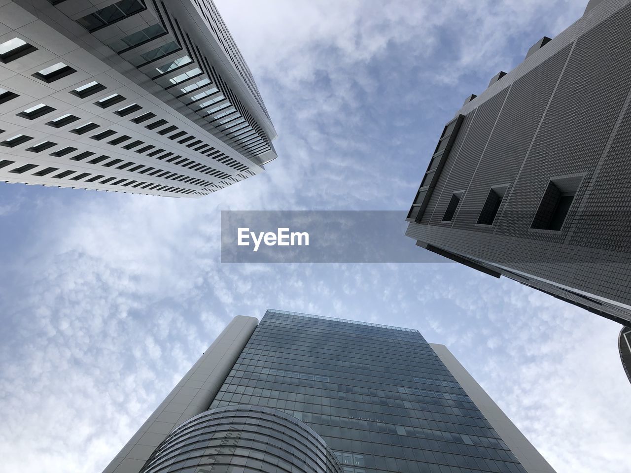 Low angle view of modern buildings against sky