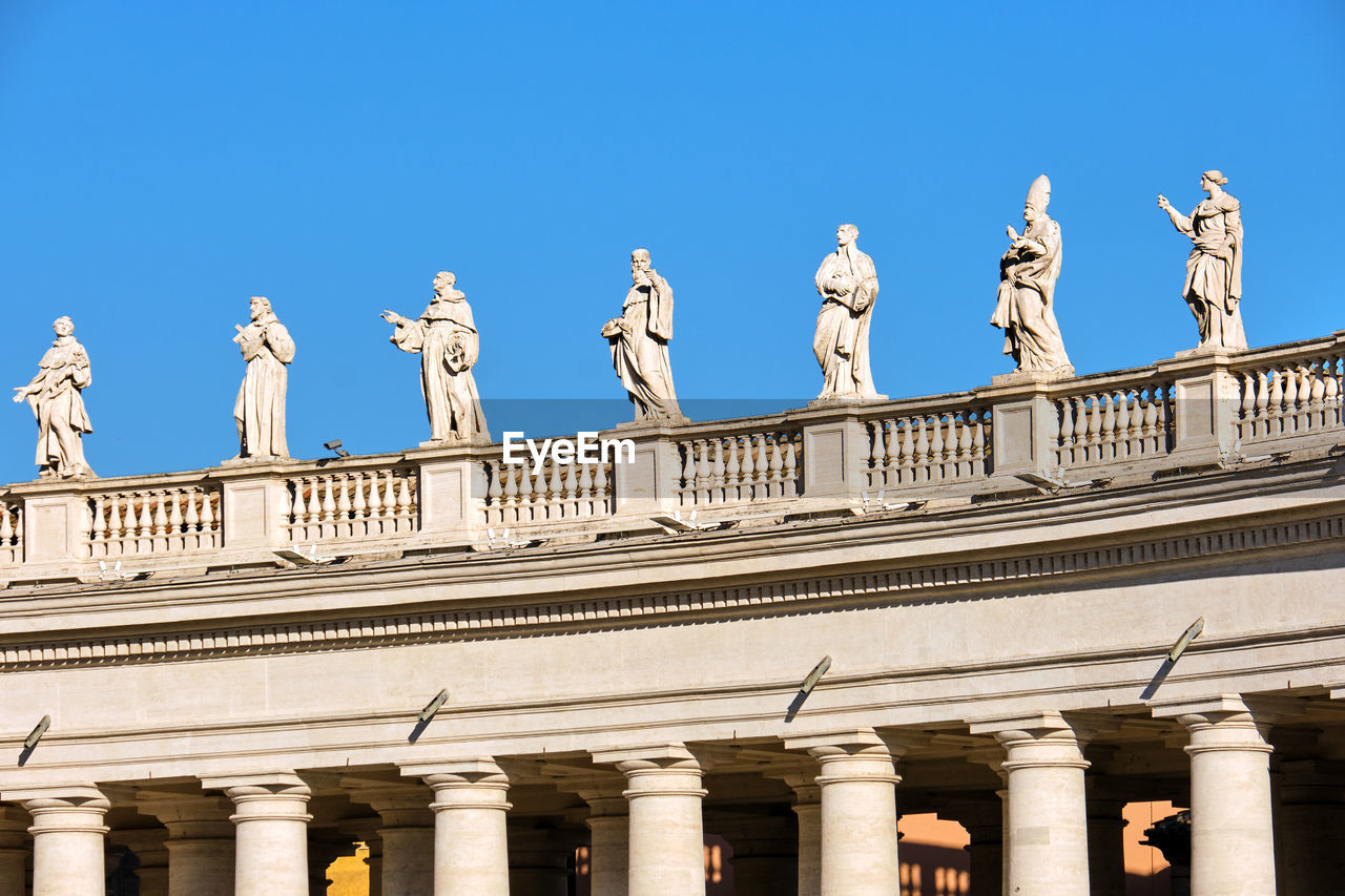 Detail of the statues and columns around st. peters square in rome