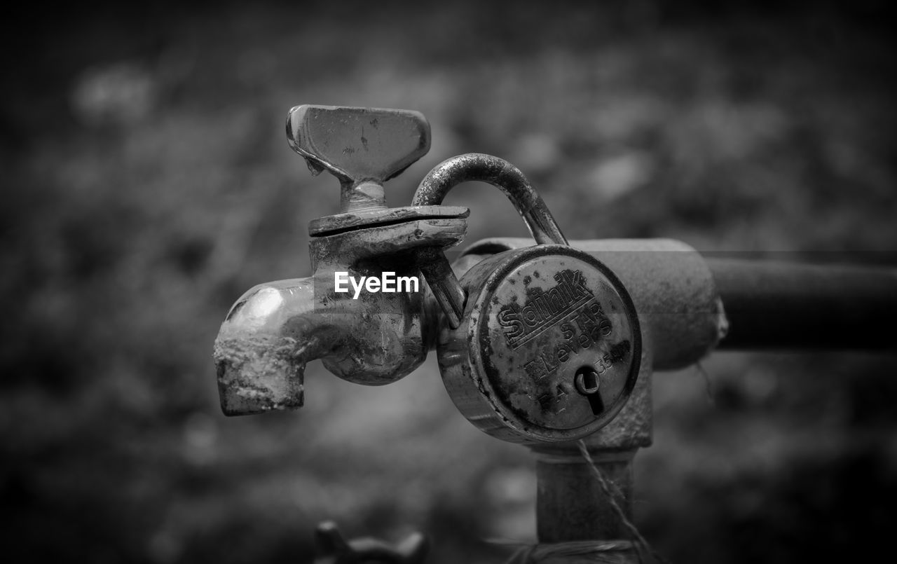 CLOSE-UP OF OLD FAUCET