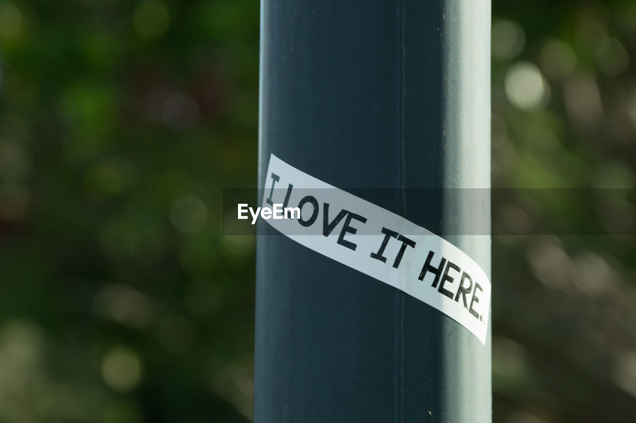 Close-up of text on pole