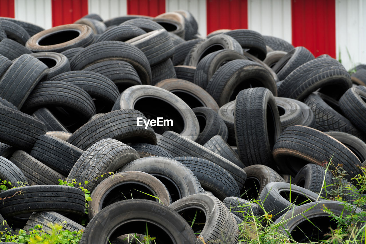 Pile of used tires. old tyres waste for recycle or for landfill. black rubber tire of car. 