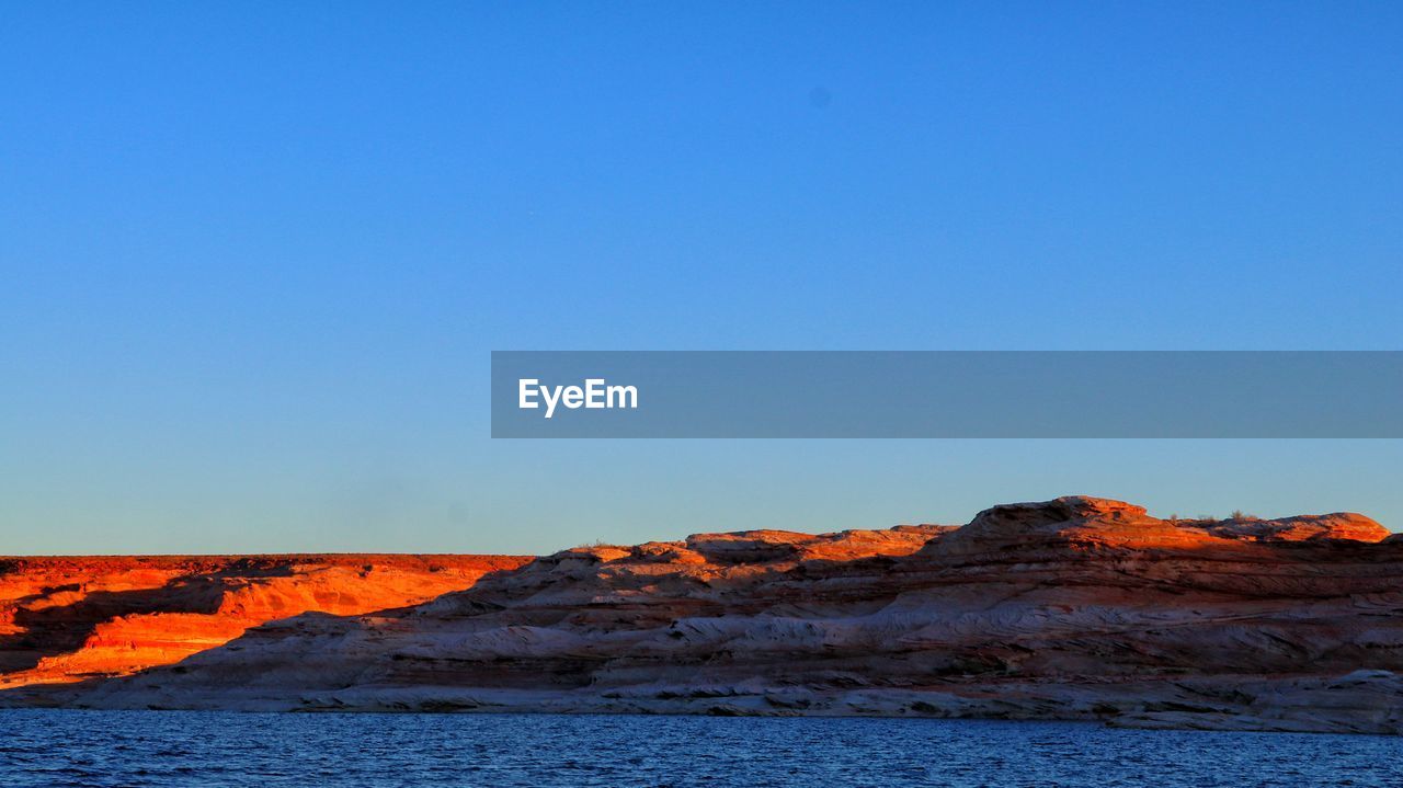 SCENIC VIEW OF LANDSCAPE AGAINST CLEAR BLUE SKY AND CLOUDS