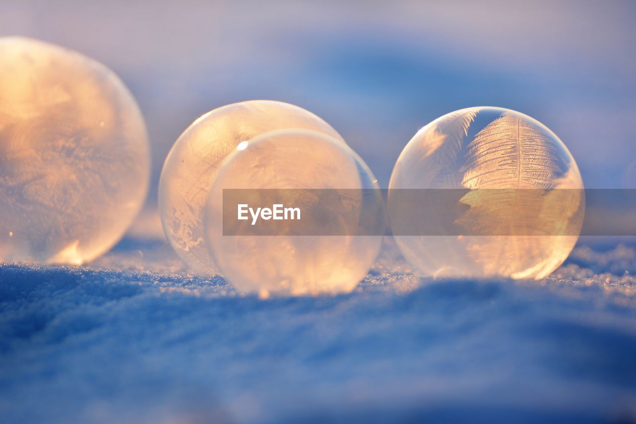 Close-up of crystal balls on snow during winter