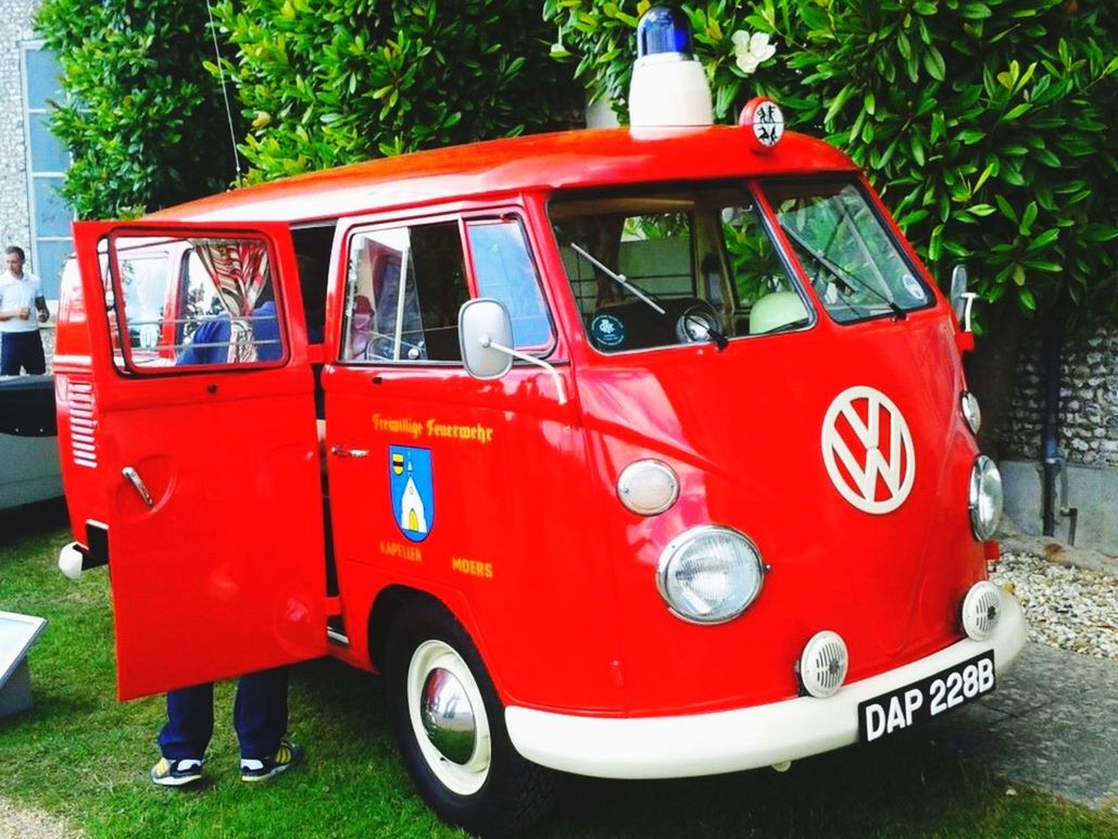 VIEW OF RED CAR ON ROAD