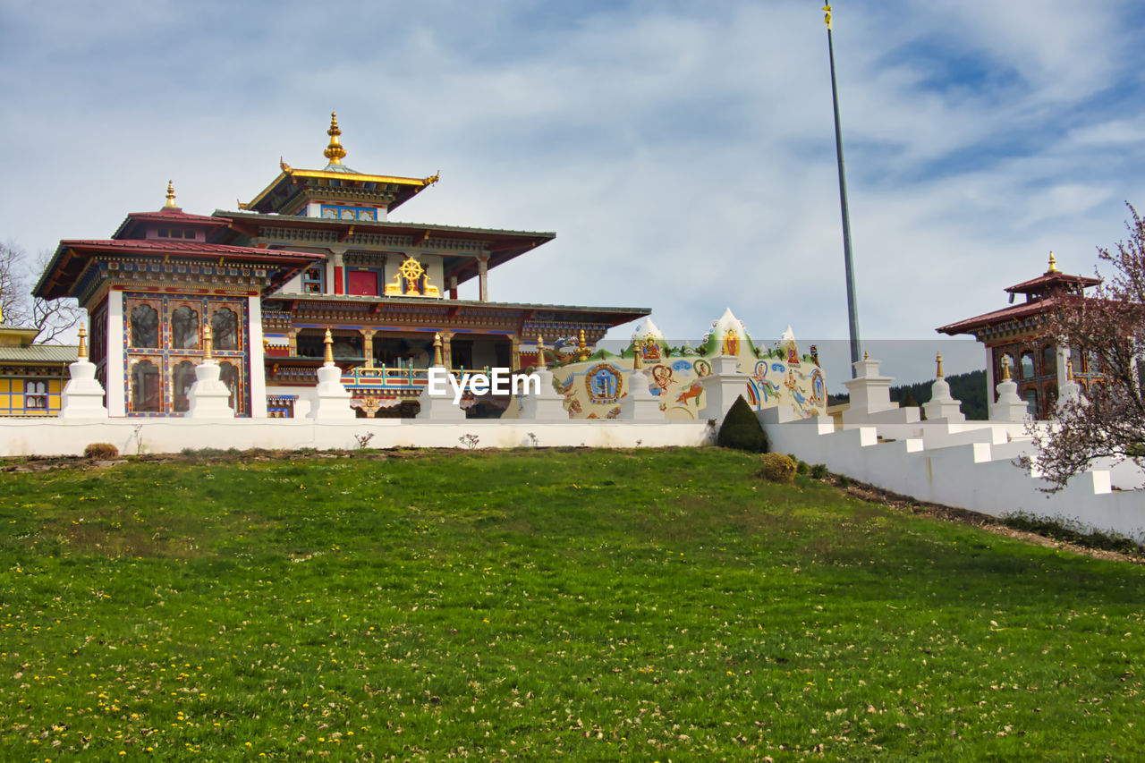 TEMPLE AGAINST BUILDING