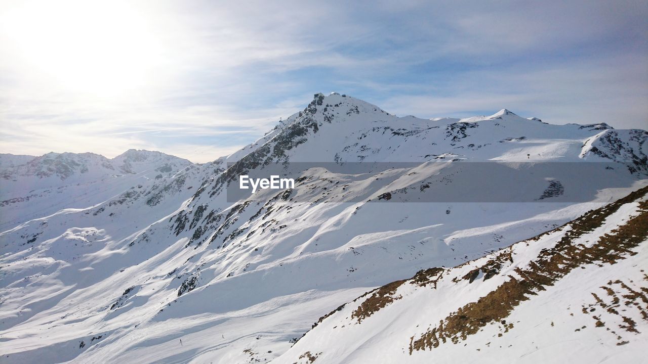 Scenic view of snow covered mountains