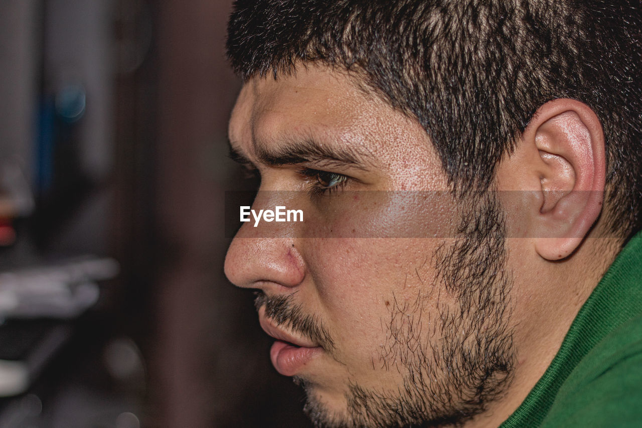 CLOSE-UP PORTRAIT OF YOUNG MAN WITH EYES CLOSED