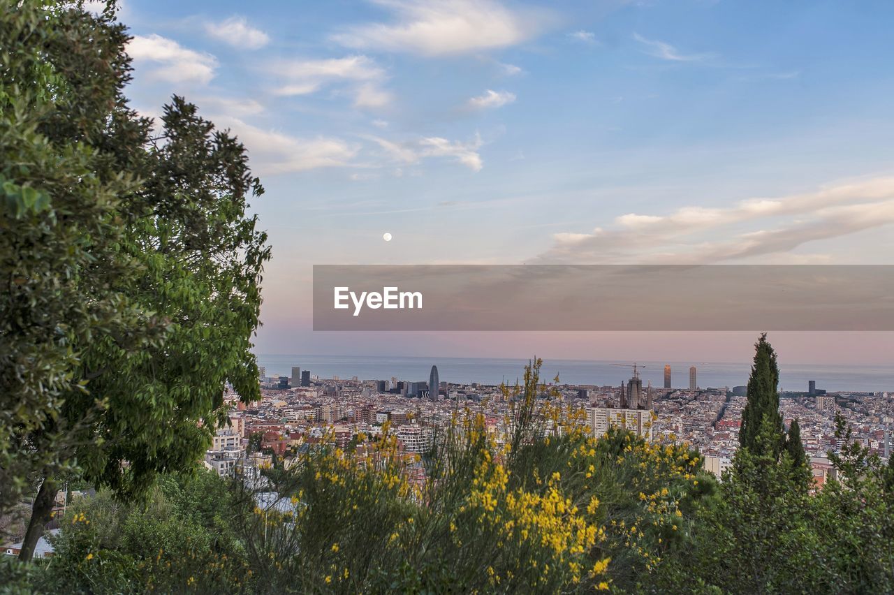 Scenic view of sea and buildings against sky