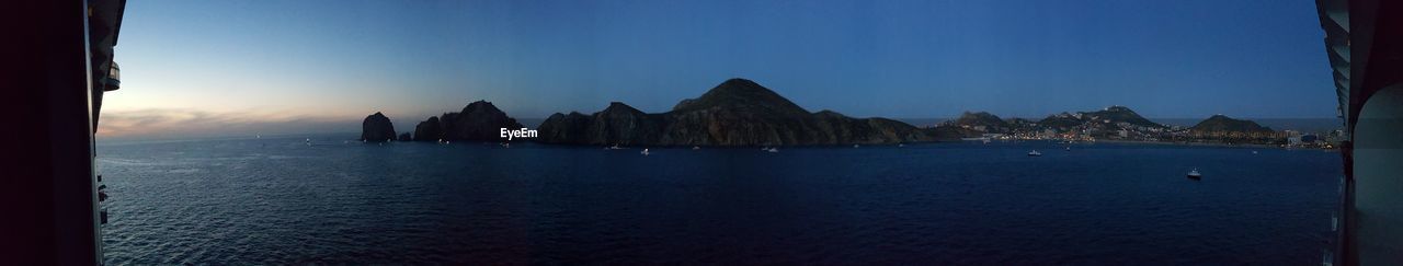 PANORAMIC VIEW OF SEA AGAINST BLUE SKY