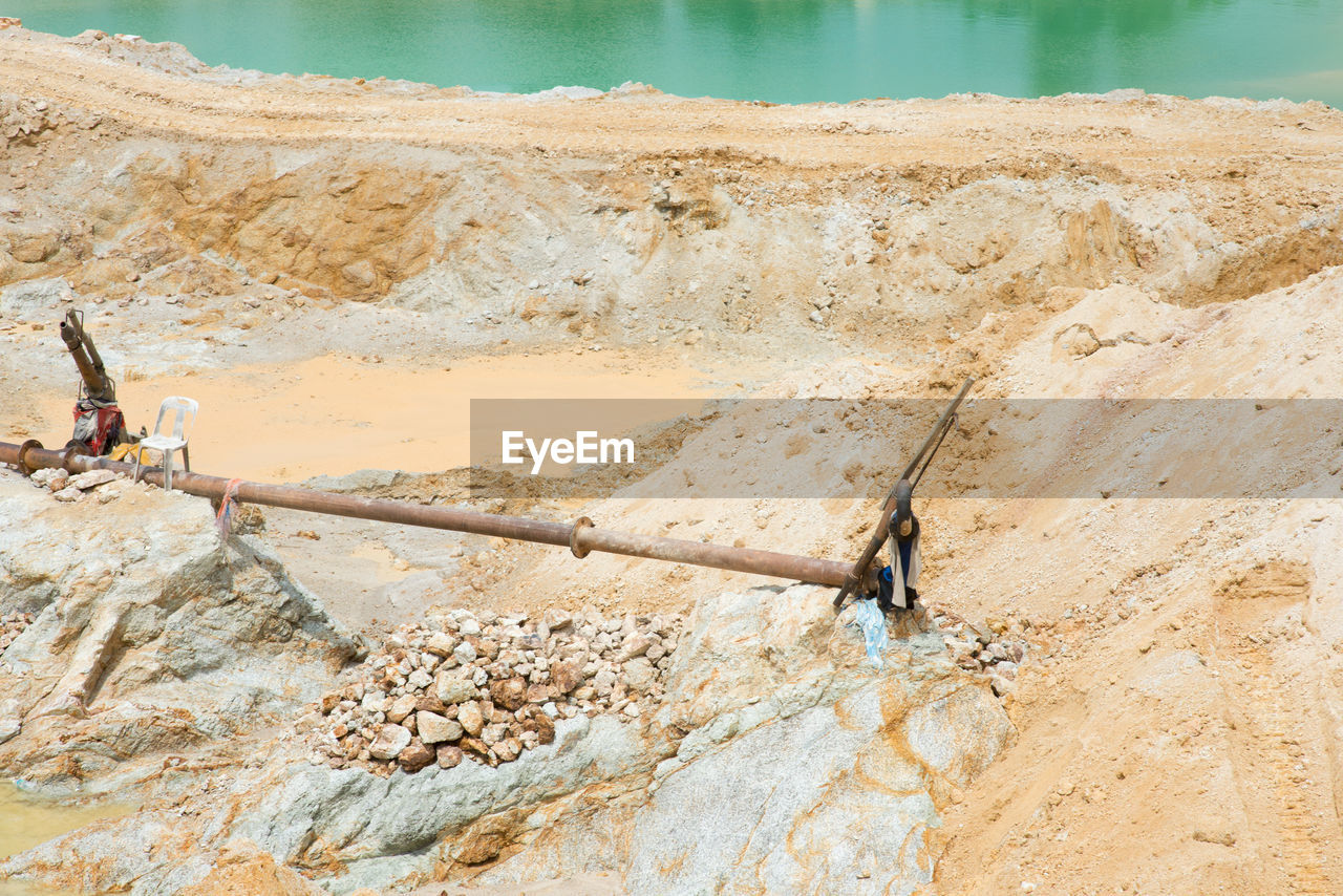 High angle view of rocks by lake