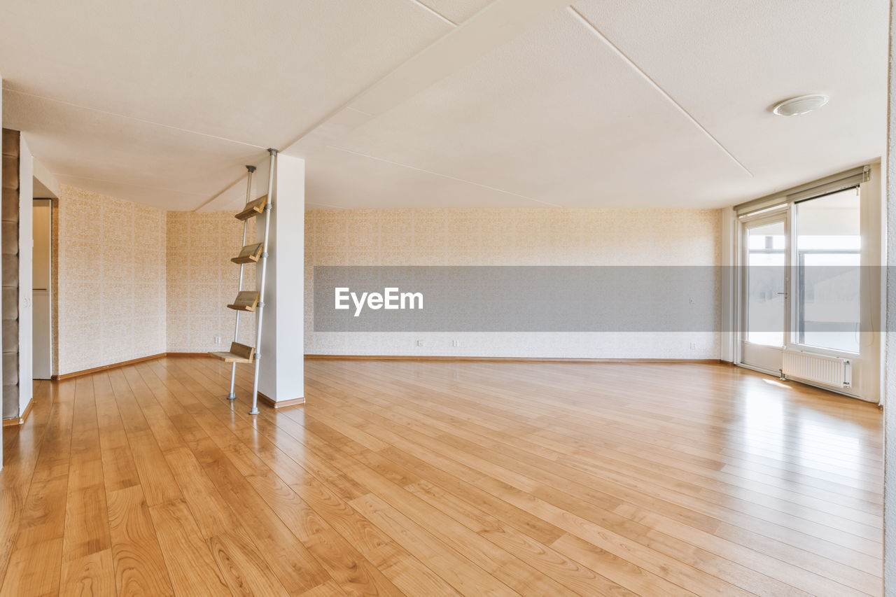 rear view of man walking in room