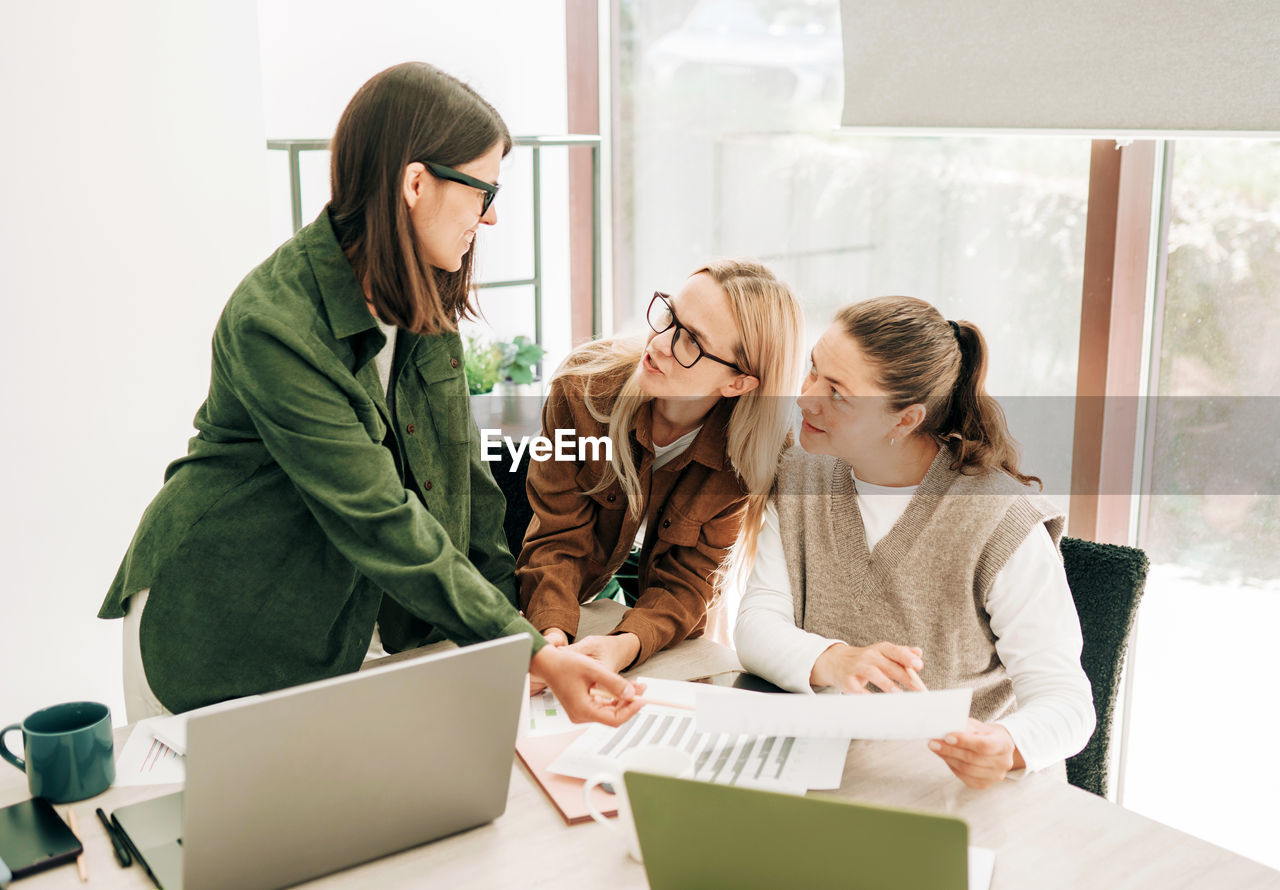 Women are having a business meeting and discussing the company's strategy.