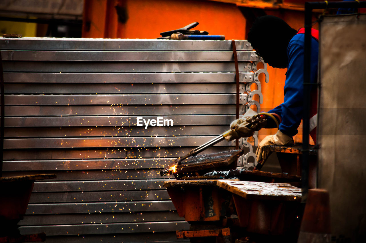 Welder working on metal structure