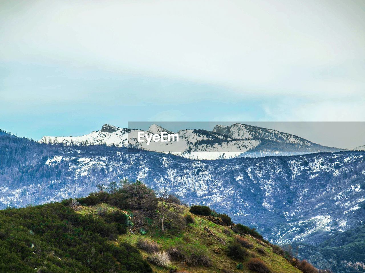 SCENIC VIEW OF SNOWCAPPED MOUNTAIN AGAINST SKY