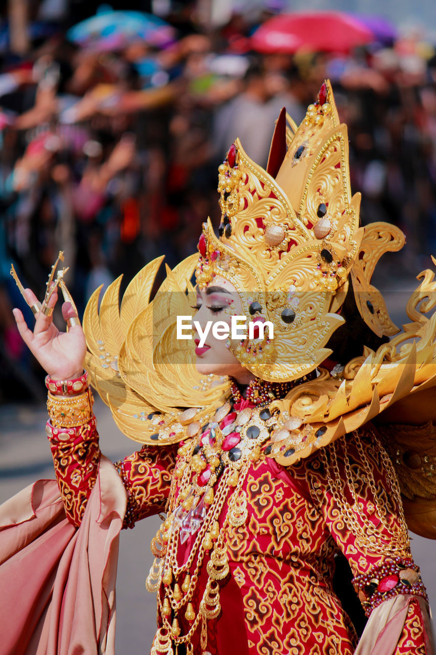 Close-up of woman in fashion show costume