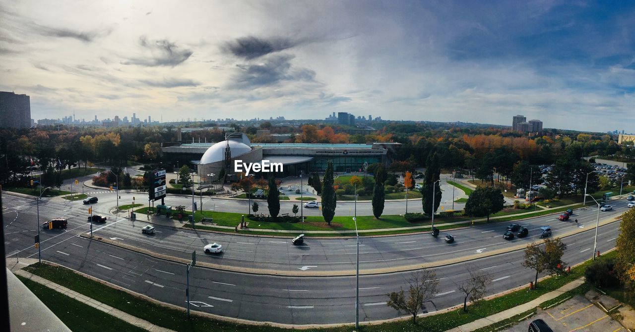 HIGH ANGLE VIEW OF PEOPLE IN FRONT OF BUILDING