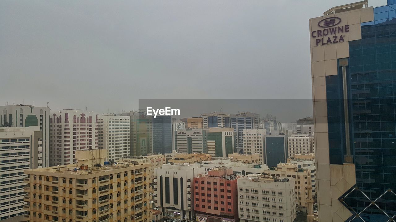 VIEW OF CITYSCAPE WITH BUILDINGS IN BACKGROUND