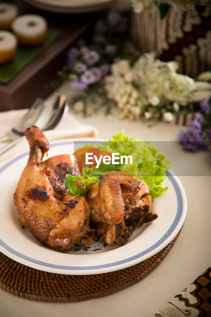 High angle view of fried chicken served on table