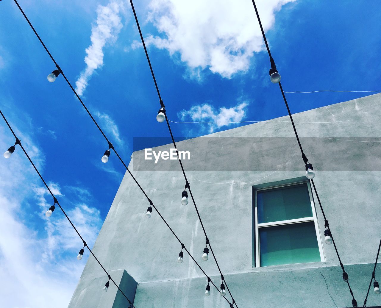 LOW ANGLE VIEW OF CABLES AGAINST SKY