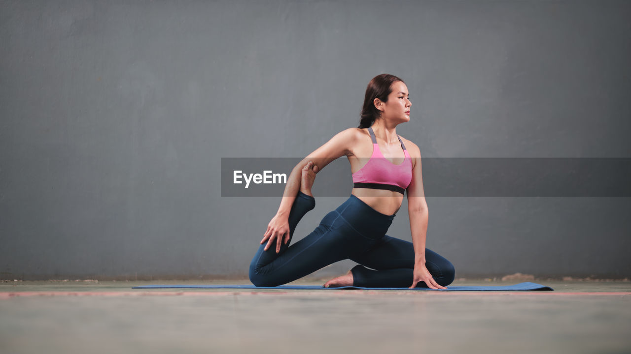 Women do yoga pose for exercise and relaxation on yoga mat