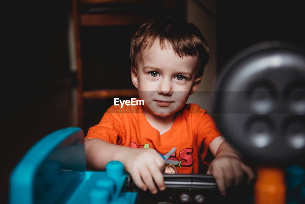 PORTRAIT OF CUTE BOY AT HOME