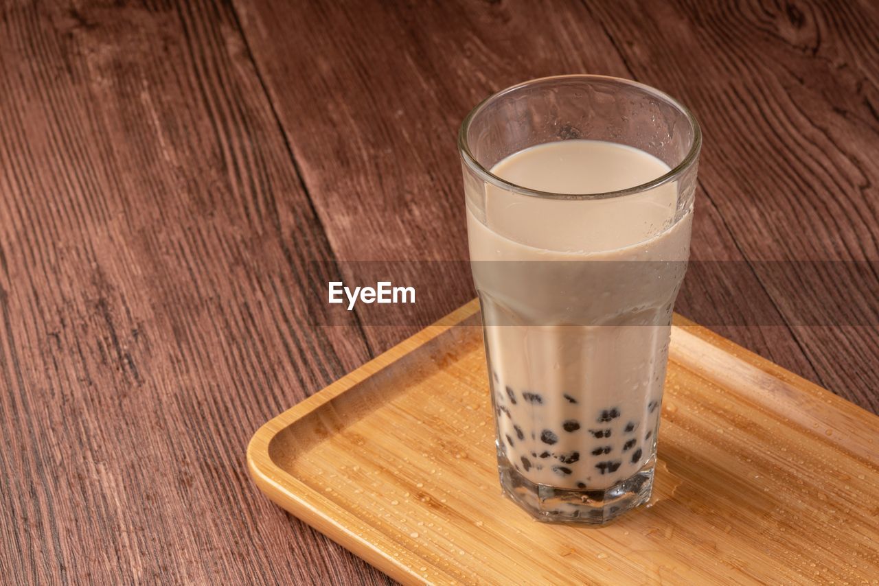 CLOSE-UP OF COFFEE ON TABLE