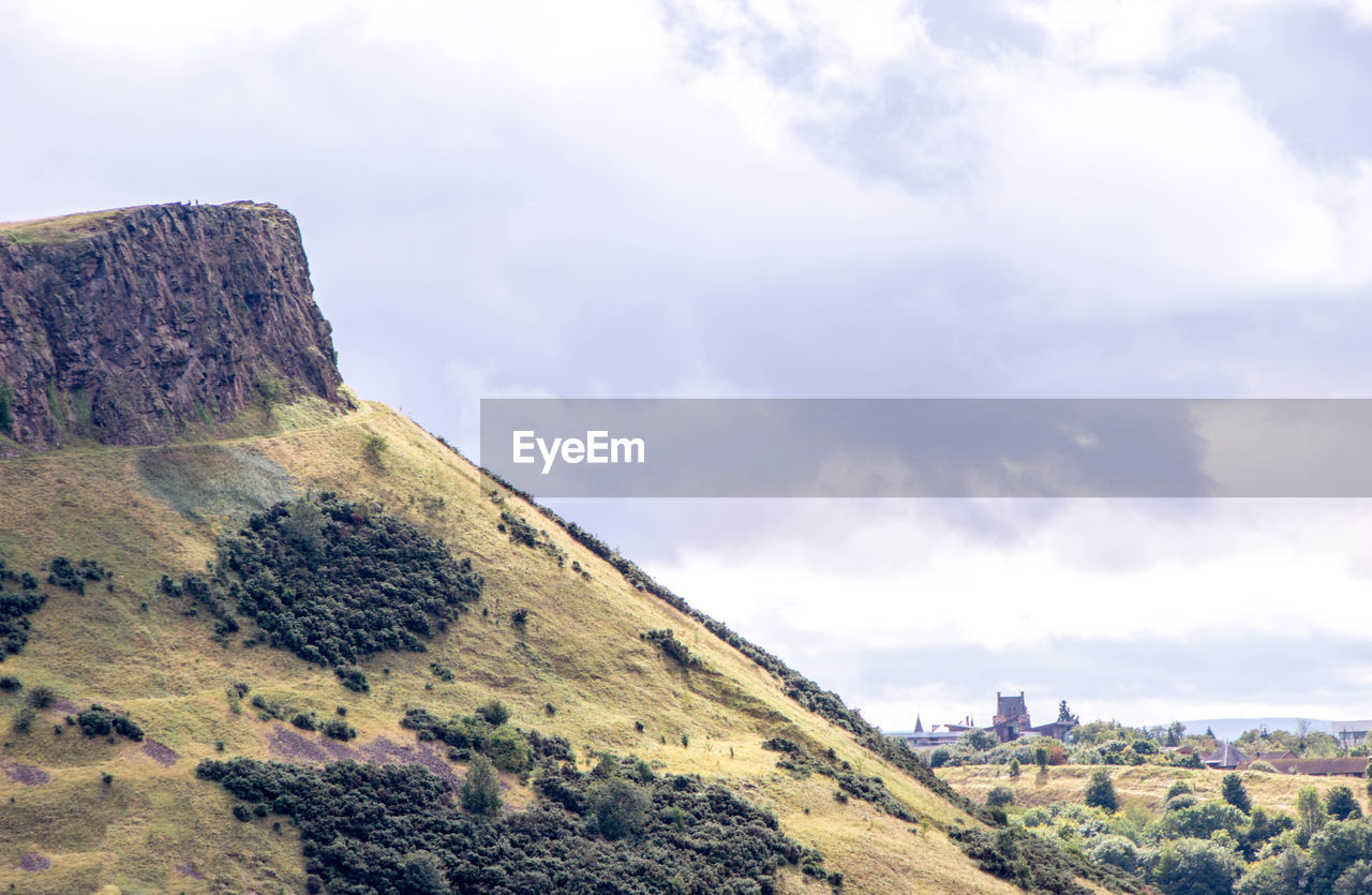 SCENIC VIEW OF ROCKS AGAINST SKY