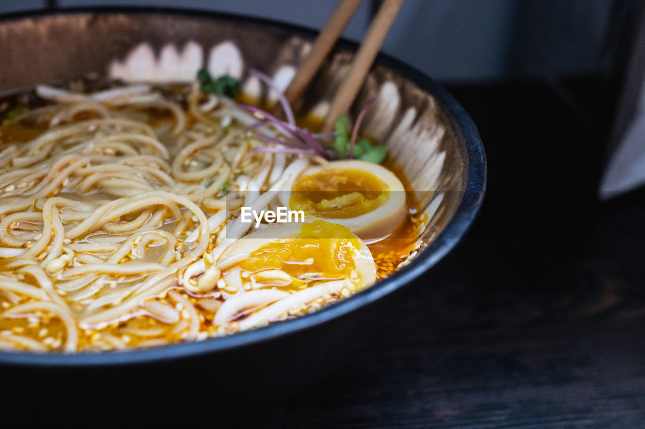 High angle view of ramen soup in bowl on table