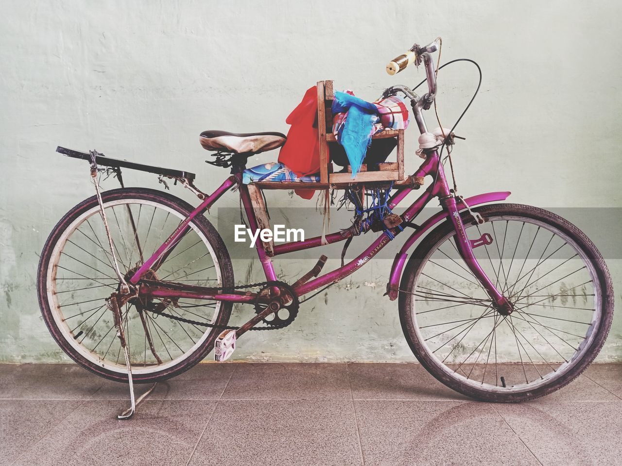 BICYCLES PARKED AGAINST WALL