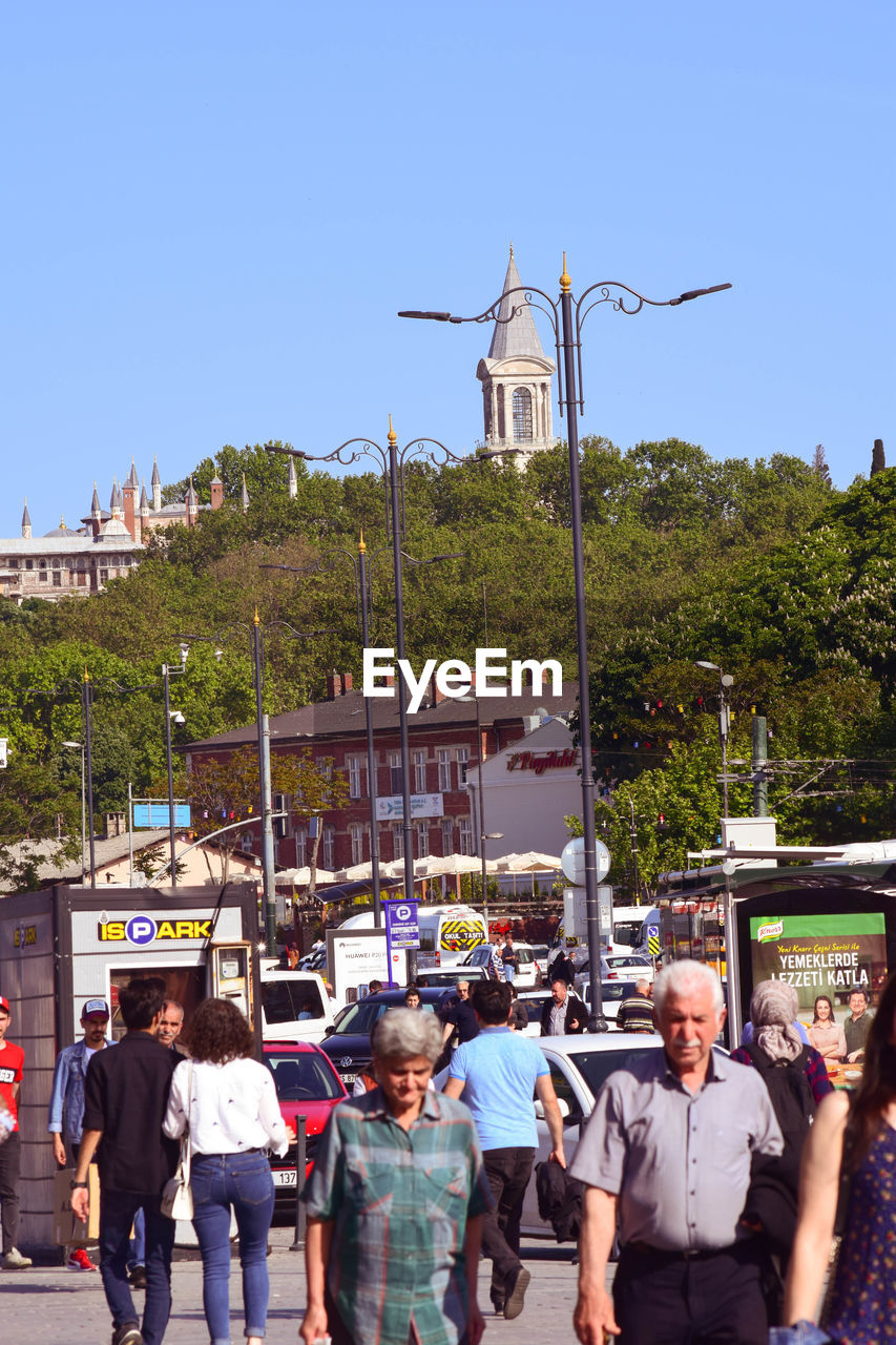 PEOPLE ON STREET IN CITY