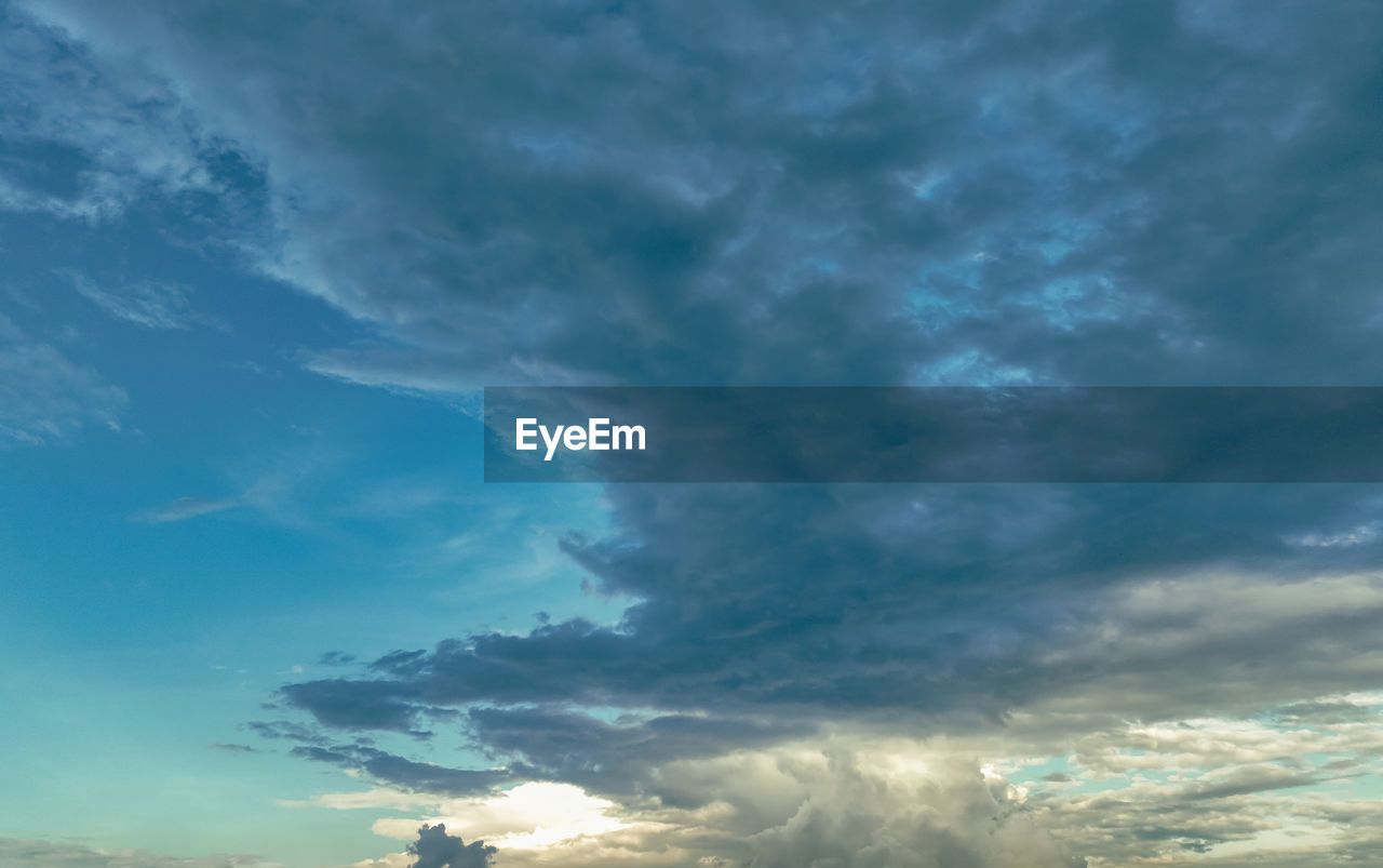 sky, cloud, environment, beauty in nature, dramatic sky, nature, storm, horizon, cloudscape, scenics - nature, no people, blue, thunderstorm, landscape, storm cloud, outdoors, dusk, sunlight, sunset, overcast, power in nature, awe, meteorology, copy space