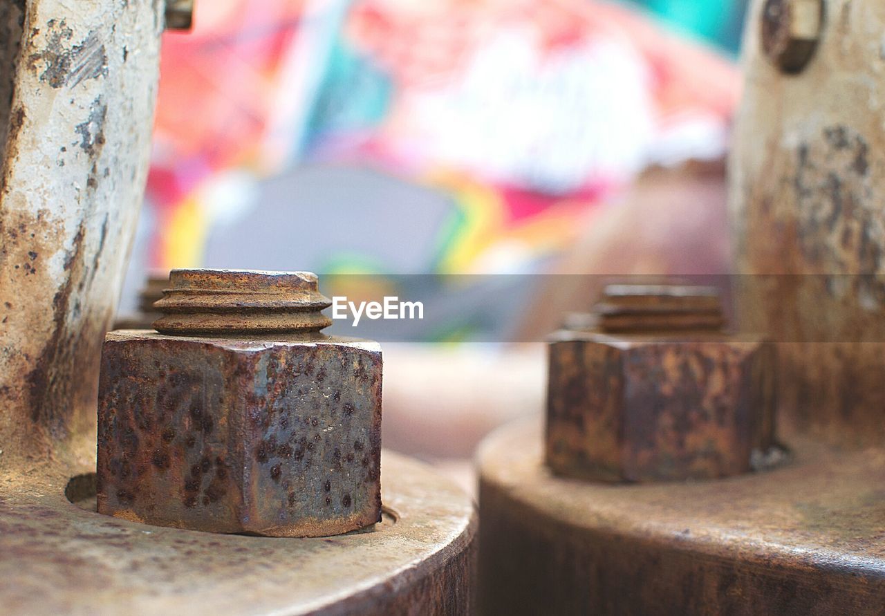 Close-up of rusty bolts outdoors