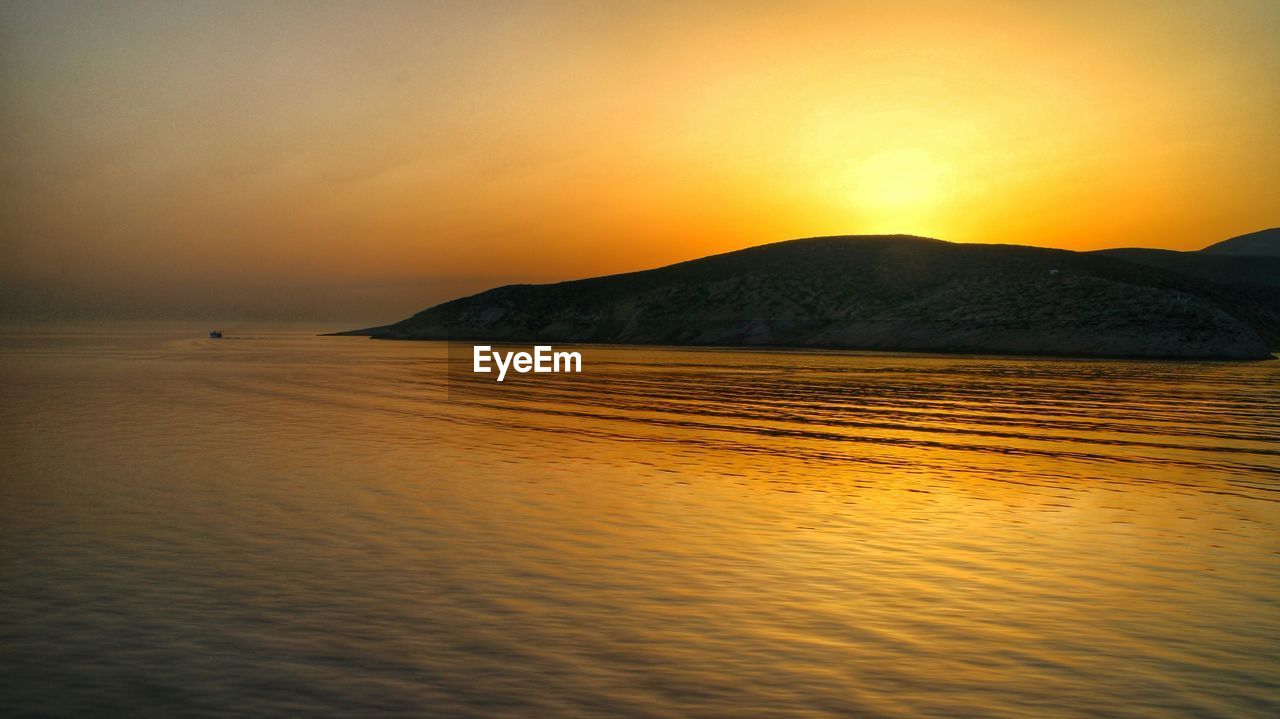 View of calm sea at dusk