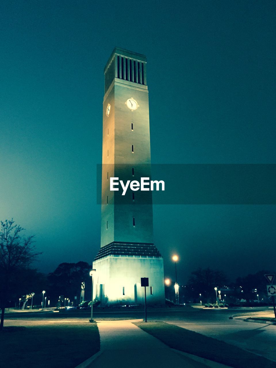 Low angle view of albritton bell tower against sky at night