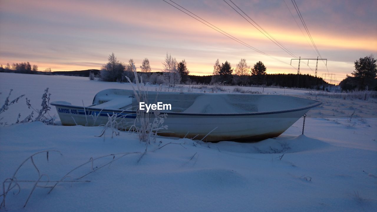 FROZEN LAKE AGAINST SKY DURING WINTER