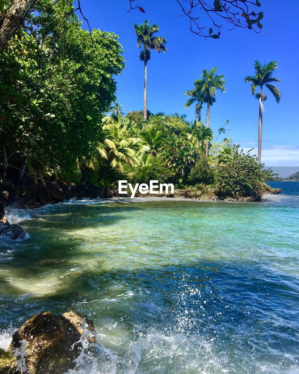 Scenic view of sea against clear blue sky