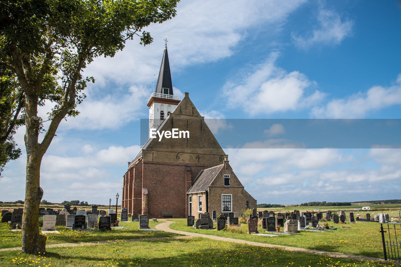 Texel, the netherlands. august 2021. the old church with cemetery in den hoorn at texel, holland.