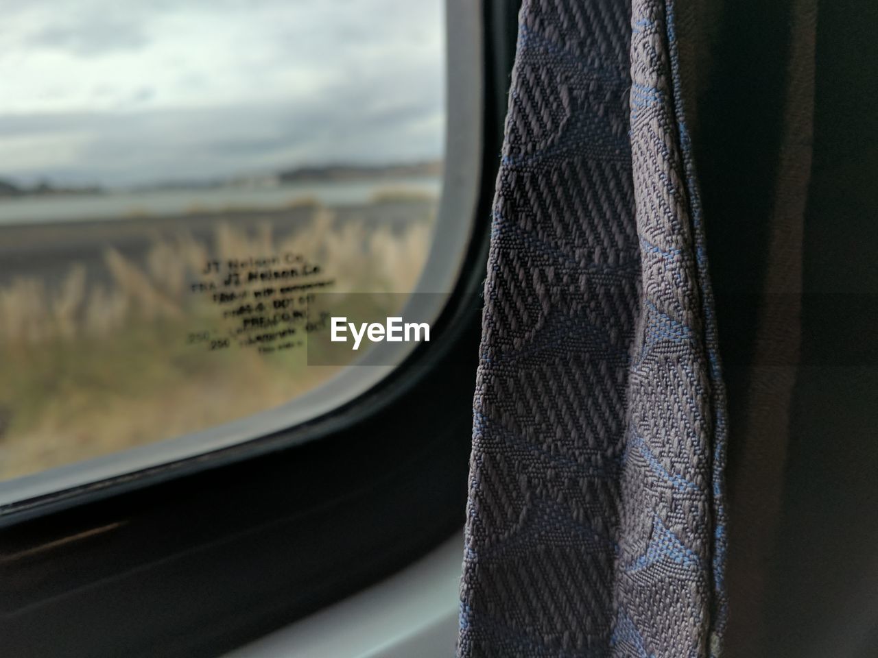 Close-up of window in train