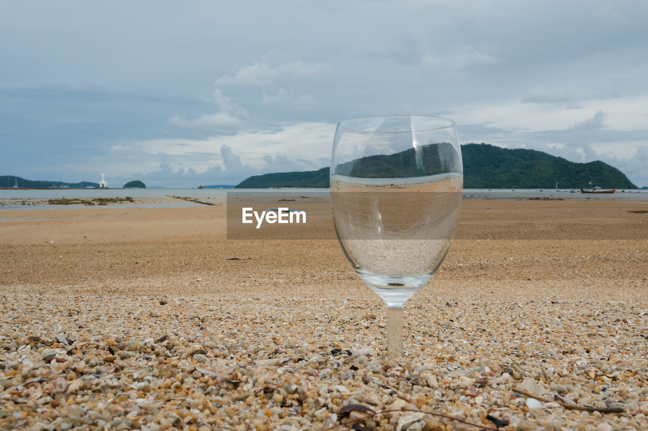 WINE GLASS ON BEACH