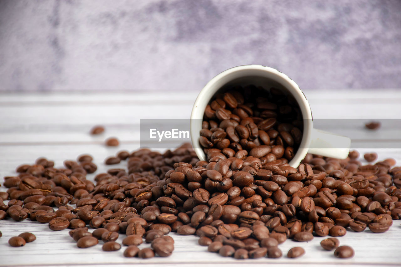 CLOSE-UP OF COFFEE BEANS IN CUP