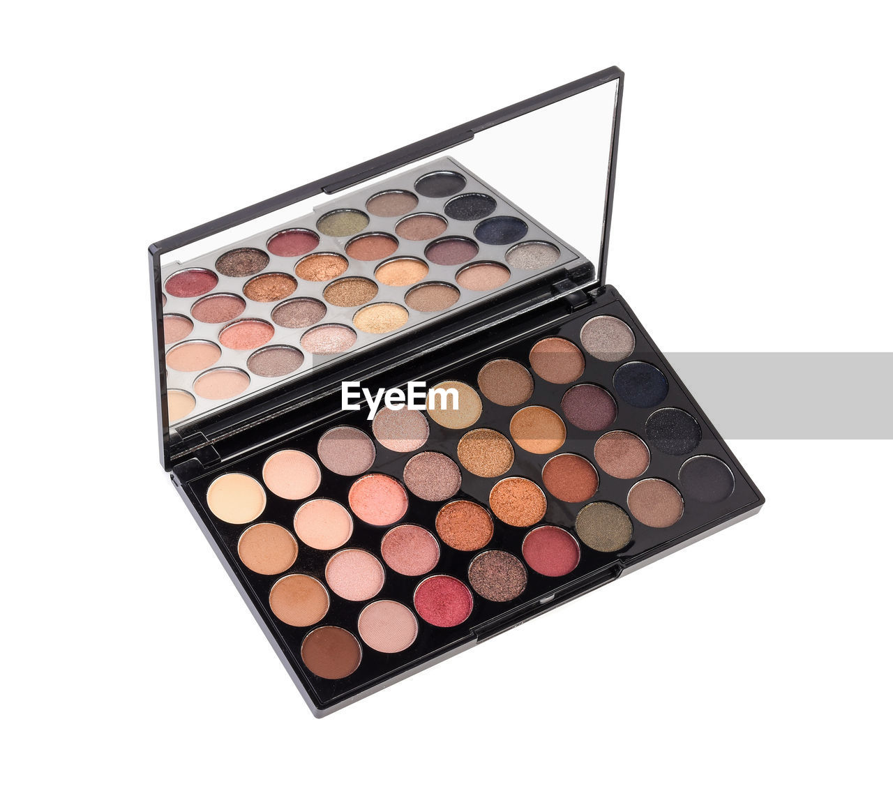 Close-up of eyeshadow palette over white background